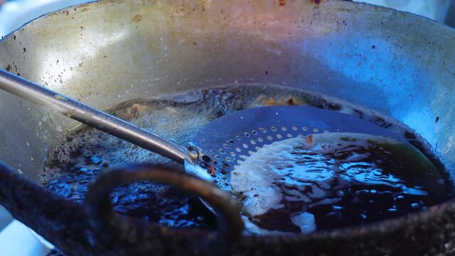 Tea snack, frying spoon, deep fried oily unhealthy food. home made recipe. Early morning breakfast. street food, pakoda, pakode.