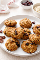 Oatmeal cranberry healthy homemade cookies with cinnamon and pecan nuts for breakfast