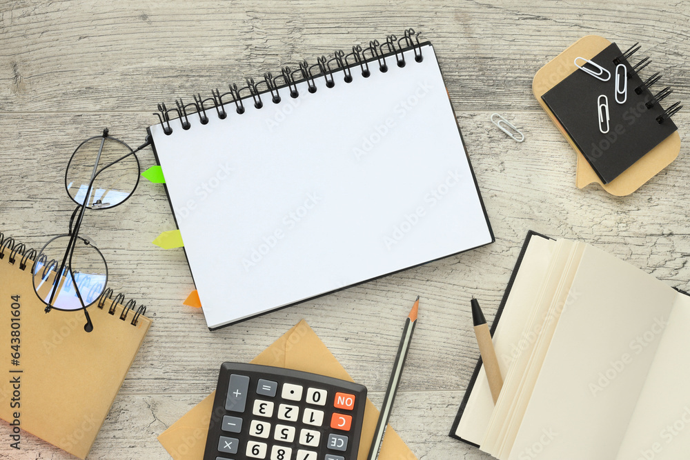 Poster copy space, flat lay. business and finance concept. notepad in the middle of the table
