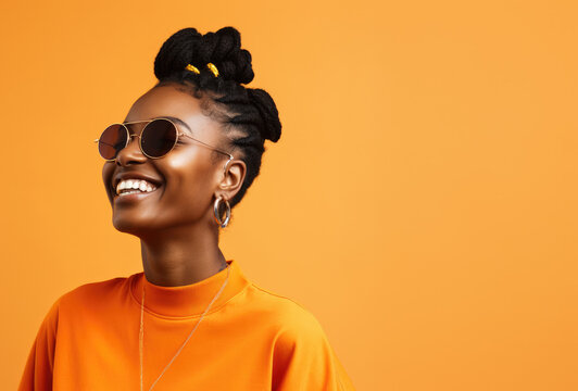 a beautiful young black woman smiling in the background of orange, minimal retouching, fine art photography, energetic, photo, expressive