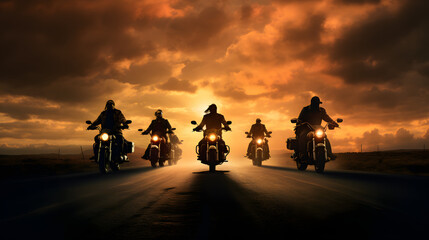 group of motorcycle riders riding together at sunset
