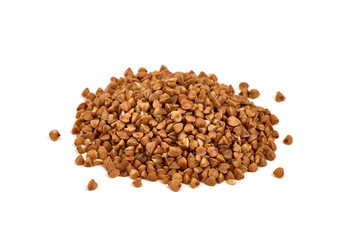 Raw buckwheat grains, isolated on white background.