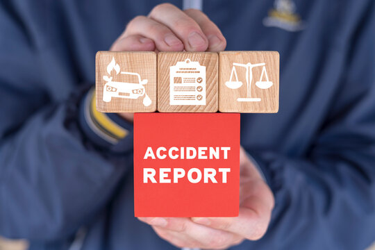Businessman holding colorful blocks and sees inscription: ACCIDENT REPORT. Concept of accident report. Claim injury compensation. Filling of accident report form.