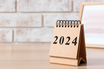 Calendar with figure 2024 on table. Banner for design