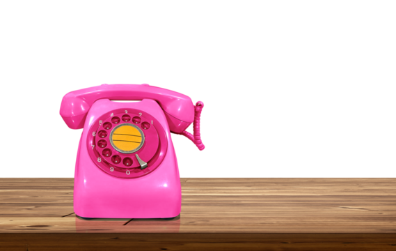 Old style pink desk phone on wooden table isolated PNG transparent