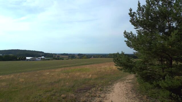 Lovely aerial view flight drone. II-62 aircraft on ground. hilly summer fields
