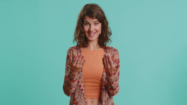 Give me money, please. Caucasian woman rubbing fingers show cash gesture, demands to pay back the debt, take loan, do shopping, begging, investment, reward. Girl isolated on blue studio background