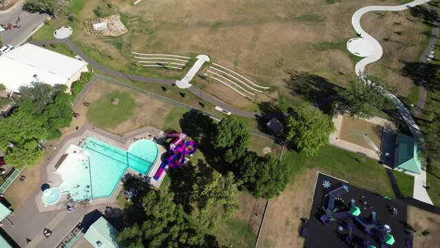 Aerial video of Haultain, Saskatoon, SK, capturing the charm of its tree-canopied streets, vintage homes, and neighborhood ambiance. A historic enclave resonating community warmth.