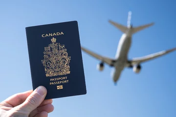 Papier Peint photo autocollant Canada Canadian Passport with Airplane in the Background