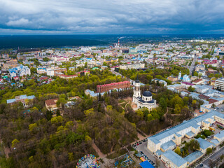 Aerial panoramic view of modern cityscape of Russian town of Kaluga overlooking black domes of Holy Trinity Cathedral