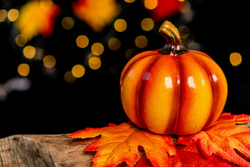 pumpkin with halloween smiley face on dark background