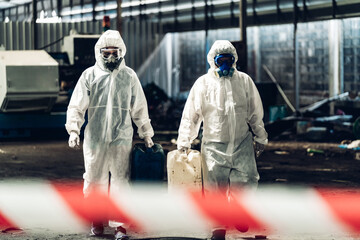 Scientist wear Chemical protection suit check danger chemical, working at dangerous zone in Red and...
