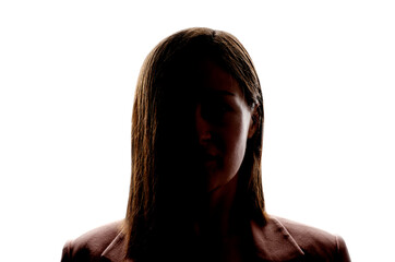 Dark silhouette of young woman on white background, the concept of anonymity.