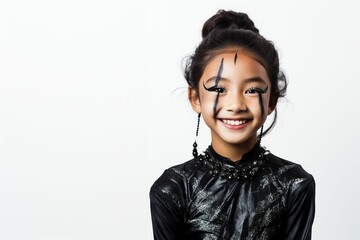 smiling asian girl with witch halloween costume