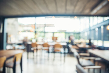 Blurred background cafe coffee shop restaurant in shopping mall with light bokeh business event...