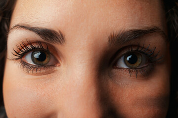 Fototapeta premium Woman's eye mirrors universe, star, soul's reflection