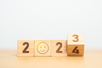 Smile face with 2024 block.  Satisfaction, feedback, Review, mental health, eco sustainable and Happy New Year concept