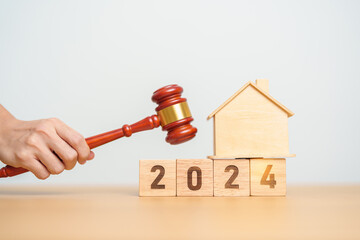 Real Estate Law, Home Insurance, property Tax, Auction and Bidding concepts. 2024 year block with...