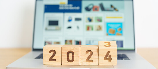2024 Year block against marketplace website. Goal, Target, Resolution, finance, E commerce, online...