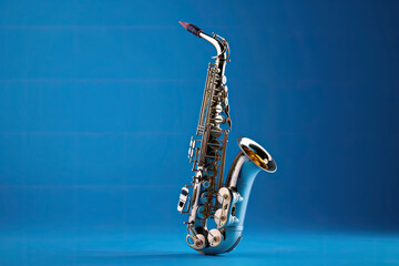 Naklejka premium Saxophone isolated on blue background. Music concept. Generative Ai.