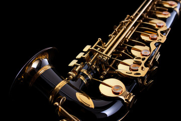 Obraz premium Saxophone jazz instruments. Saxophone music instrument closeup on black background. Generative Ai