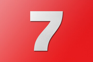 White paper font number 7 isolated on red background.