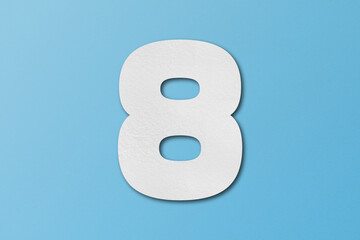 White paper font number 8 isolated on light blue background.