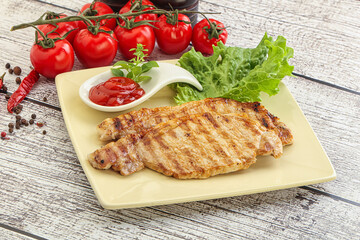 Grilled pork steak with ketchup