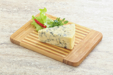 Blue cheese piece over board