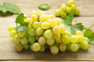 Shine Muscat Grape. Bunch of green grape on grey wooden background. Vertical photo