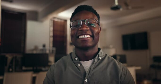 Face, video call and hello of black man in home, remote work or communication at night. Portrait, wave and happy professional in webinar of creative designer in glasses in business meeting conference