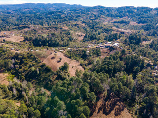 Fototapeta na wymiar Aerial view over forests and coffee plantations in highlands Honduras, and with a nice sunrise light