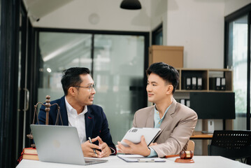 Business and Male lawyer or judge consult having team meeting with client, Law and Legal services concept.Customer service good cooperation in office