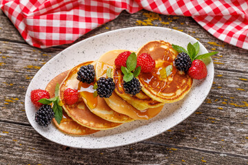 Tasty homemade pancakes with berries
