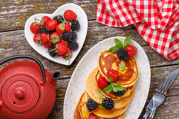 Tasty homemade pancakes with berries