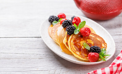 Tasty homemade pancakes with berries