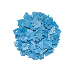 top view flat lay overhead blue flake plastic waste isolated on white background. pile of blue...