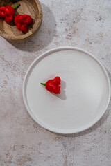red hot chili pepper on a white plate