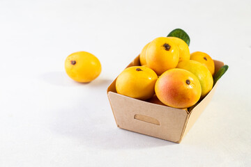 Organic Mango Fruit On Purple Neon Background