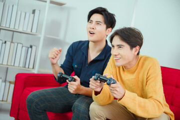 LGBQ concept of sexual diversity Asian gay couple having fun playing games