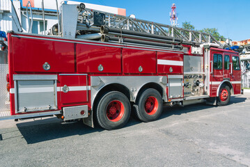 A fire truck with a retractable ladder for extinguishing fires at a height. A fire truck for the delivery of firefighters to the place of fire and the supply of extinguishing agent for extinguishing.