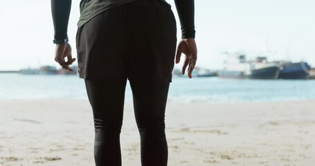 Runner person at the beach, stretching legs and fitness with cardio, preparation and strong with back view and workout. Warm up, running in nature and training, race and health with exercise outdoor