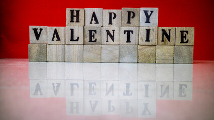 Happy valentine's day from stacked wooden blocks