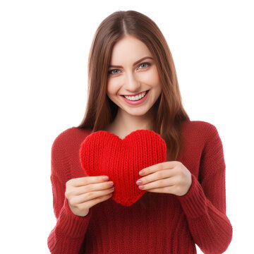 Happy young woman wigth knitted heart in hands