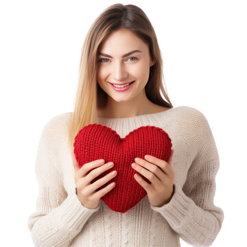 Happy young woman wigth knitted heart in hands