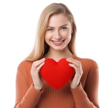 Happy young woman wigth knitted heart in hands