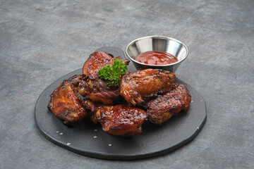 Roasted chicken wings with honey and spices 
