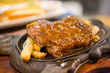 Beef steak with pepper sauce with French fries