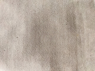 Grey rough foam background and texture. Abstract drawing, place for text, copy space. Partial focus, blur and blurred
