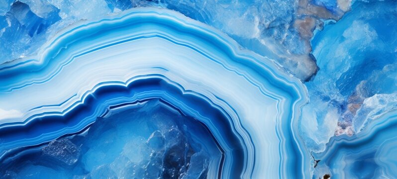 Closeup of polished abstract blue white agate crystal natural quartz healing stone texture background